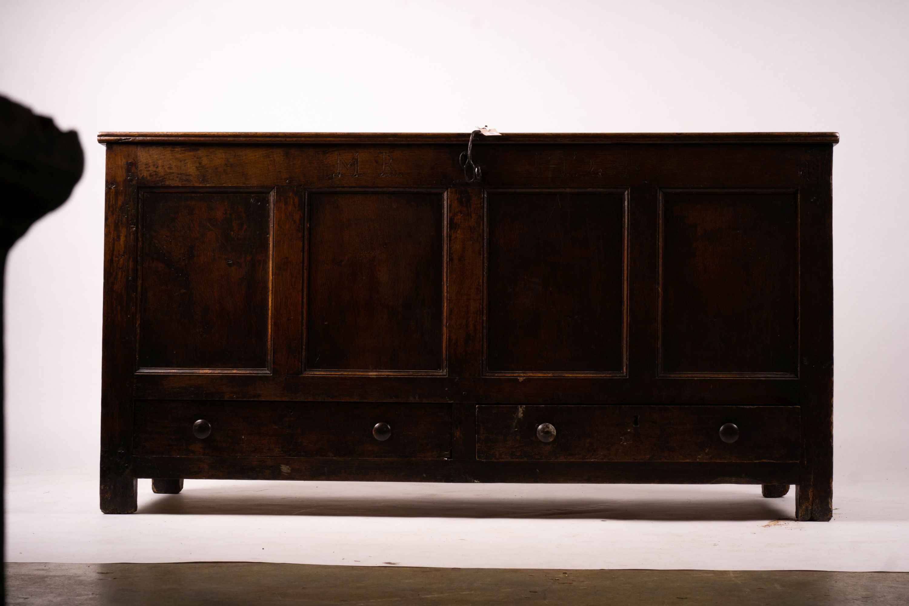 An 18th century panelled oak mule chest, length 161cm, depth 61cm, height 84cm